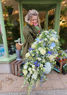 Blue and white funeral arrangement
