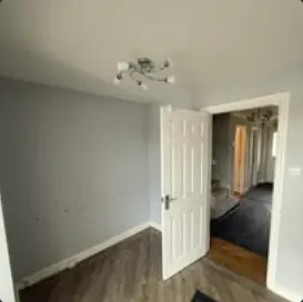 Renovated room with new internal door and flooring