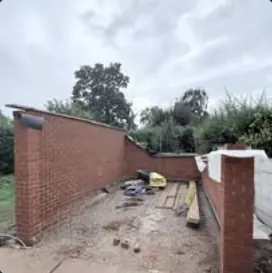 New garden brick wall under construction