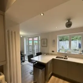 Kitchen diner with breakfast bar and garden doors