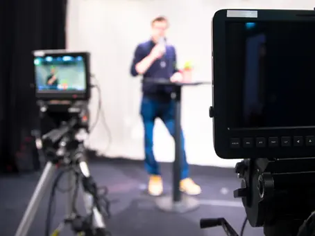 A CEO filming a video in a studio.