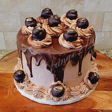  Sophisticated flavor profiles using classic cake bases, gourmet fillings, fresh fruits, mousses, truffles, and preserves, enhance cakes with infused simple syrups, including liquor-based options, and explain how to properly work with bakery-style stabilized whipped cream.