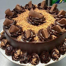  Sophisticated flavor profiles using classic cake bases, gourmet fillings, fresh fruits, mousses, truffles, and preserves, enhance cakes with infused simple syrups, including liquor-based options, and explain how to properly work with bakery-style stabilized whipped cream.