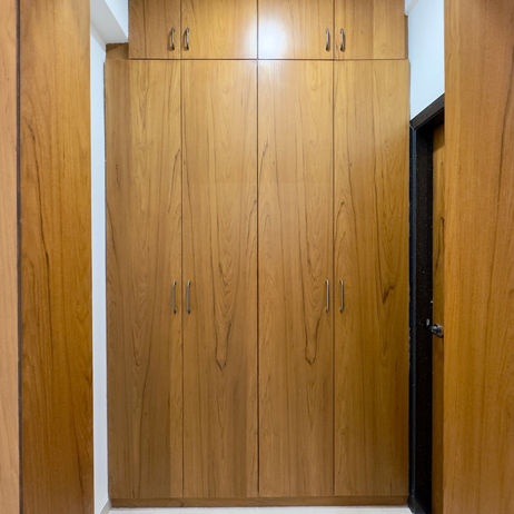 Modern floor-to-ceiling wooden wardrobe in Luxury Flat 2