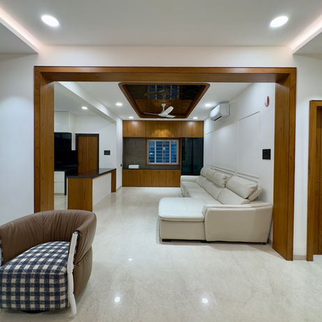 Modern living room in The Luxury Flat 2 with wood trim.