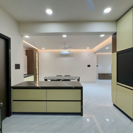 Modern kitchen island and dining area in The Luxury Flat 1