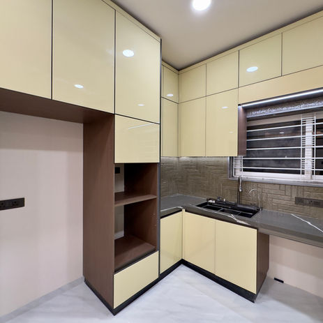 Modern cream and wood finish kitchen in The Luxury Flat 1