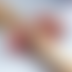 A hand stopping the domino falling knocking the rest of the dominos falling