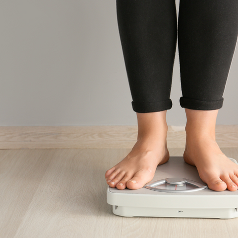 Women standing on scales