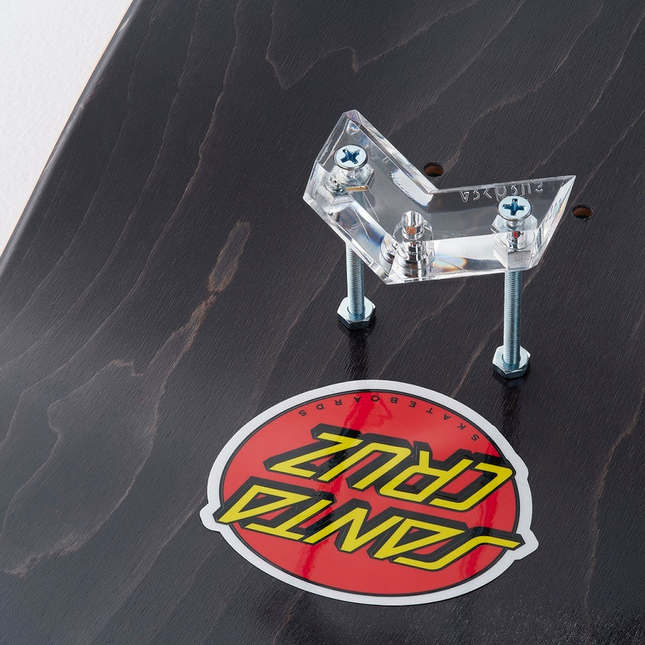 Skateboards and cruiser boards displayed on transparent wall mounts creating wall art