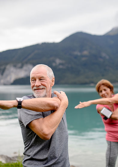 Senior couple doing outdoor yoga, tai ch