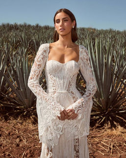 Perfect for the bride seeking a unique look, Burke is a boho wedding dress that will transform your wedding day into an event worthy of a woodland queen. This enchanting gown, with her long, dramatic bell sleeves and sultry mermaid silhouette, is for brides who want to stand out from all the brides who came before. Not to mention her silhouette will help you create epic photos as your photographer catches the movement of her skirt. Designed for the free-spirited bride with a love for luxury, Burke exudes a vintage charm while embracing contemporary sophistication.

Northern Ireland Exclusive stockists.