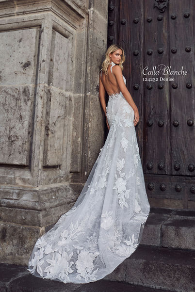 Unveil your inner goddess with a backless mermaid wedding dress that balances sexiness with class. Adorned with delicate lace and 3D floral appliqués, and designed with a structured bodice with tank straps and a sweetheart neckline, Denise ensures bridal perfection. Her backless design adds a touch of sexy sophistication, while her form-fitting mermaid silhouette highlights every curve. Ideal for the bride seeking a blend of classic romance and contemporary style, Denise promises to make you the focal point of your special day.
Exclusive stockists in Northern Ireland and Donegal