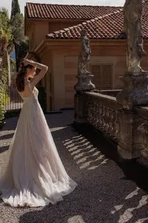 Back view of Issa wedding dress with elegant sweep-length train