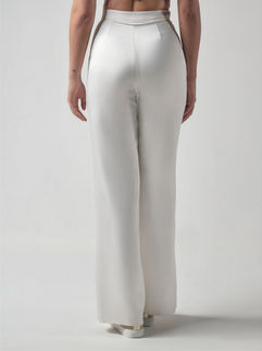 A lovely pair of bridal trousers made of ivory colour, matte satin. They are straight fit and have a zipper fastener and pockets.