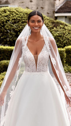 Style 44276 from SINCERITY BRIDAL BY JUSTIN ALEXANDER. Bridal Shop Northern Ireland Bridal Shop NI.
Plunging V-Neck Satin Ball Gown with Fully Beaded Bodice
A dazzling take on a classic silhouette, this satin ball gown features a sexy plunging V-neckline with thin straps that give way to an open V-back. Unique appliqués of embroidered beading over a glitter tulle underlay create modern sparkle. The soft satin skirt is finished with pockets and buttons extending down the chapel length train. It's paired with a matching cathedral length veil, available separately as 44276V. A raised neckline option is also available for this style.
COLOR SHOWN IN
Ivory/Nude
COLORS
Ivory/Nude
SILHOUETTE
Ball Gown
NECKLINE
V-Neck, Plunge
WAISTLINE
Natural
TREND
Graceful Classics
FIGURE
Curvy
FABRIC
Beading, Embroidery, Lace, Satin, Tulle
TRAIN LENGTH
Chapel
Available instore in Bridal Curve size