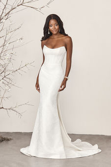 44384 Sincerity Bridal
Jacquard Fit and Flare Bridal Gown Featuring Strapless Neckline. Stand out in this jacquard fit and flare bridal gown featuring a strapless scooped neckline with modern seaming on the bodice. A matching detachable belt is included with the dress. The look is finished with a center godet on a chapel length train while jacquard covered buttons extend down the back of the skit. For a touch of romance, pair with a detachable jacquard bow on back, sold separately as 44384BOW. A stretch Mikado version of this bridal gown is available as 44384A.