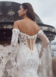 Calla Blanche 123110 Amal 
Excusive Stockists in Northern Ireland and Donegal 
Beaded Lace
Sheath Silhouette
Straight Neckline
Long Off the Shoulder Sleeves
Button Details