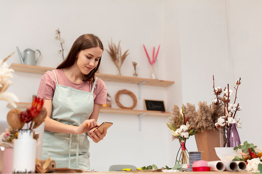 medium-shot-of-business-woman-using-her-mobile-phone.jpg