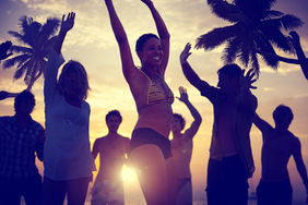 lovely couples dancing at the sunset over beach