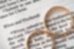 two-golden-wedding-rings-and-opened-pages-of-holy-2023-11-27-05-21-03-utc_edited.jpg