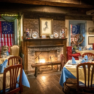 one of our four dining rooms & fireplaces
