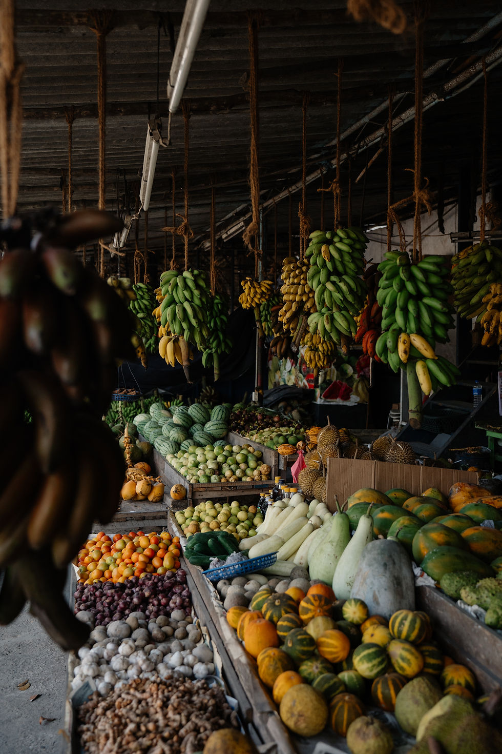 An assortment of vegetables in a rustic, local Sri Lankan market, offering a glimpse into the island's fresh and diverse harvest.