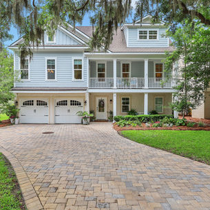 Home in a gated Wilmington Island community with marsh views and moss-draped oak trees near Savannah