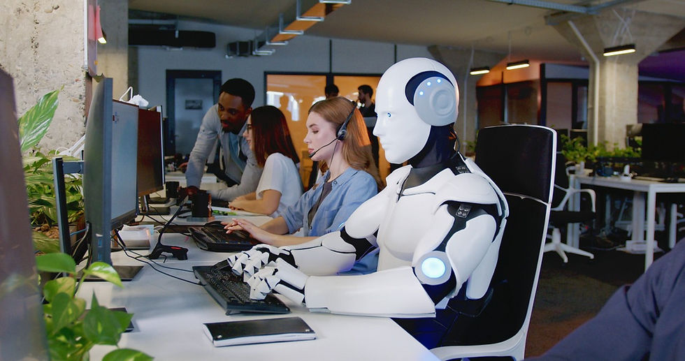 Humanoid robot sits alongside people on a help desk