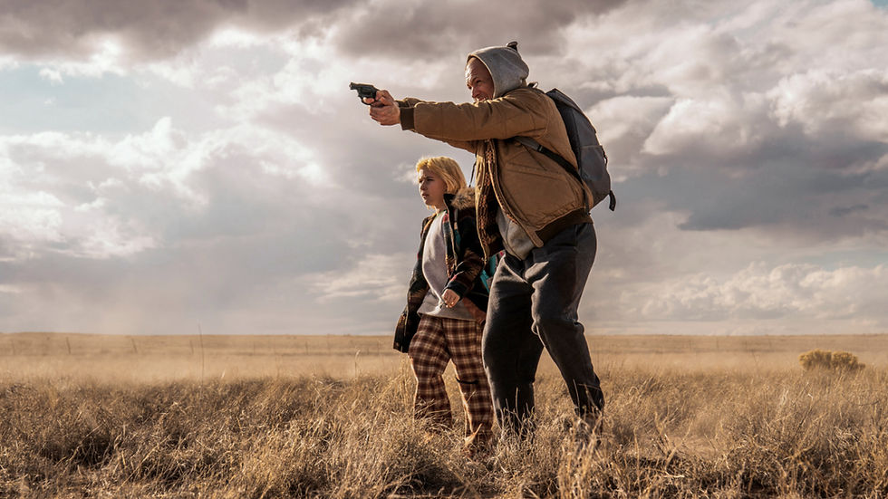 Nathan (Taron Egerton) tries to keep Polly (Ana Sophia Heger) safe in She Rides Shotgun (Distributed by Lionsgate)