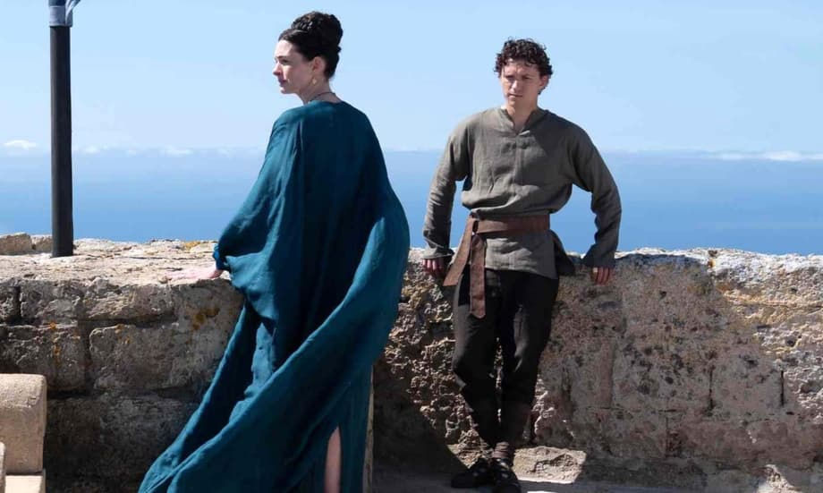 Penelope (Anne Hathaway) talks with Telemachus (Tom Holland)