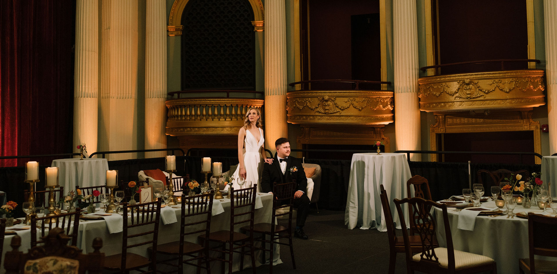 Elegant couple sitting in grand theater of The Orpheum Champaign
