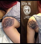 rose tattoo on shoulder blade