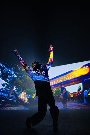 Person joyfully celebrates, projected race finish