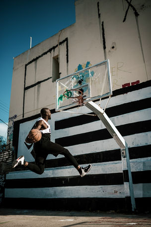 Man executing a powerful dunk