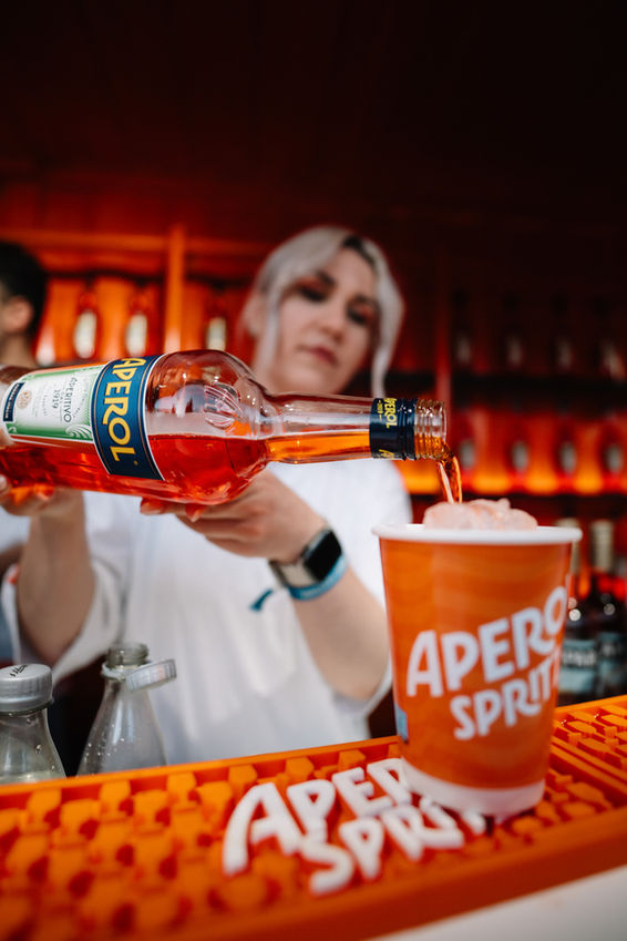 Bartender pouring Aperol Spritz