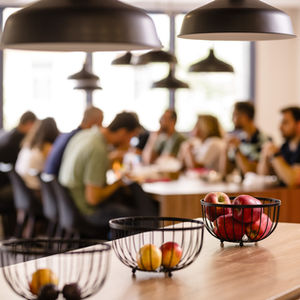 Team lunch: apples in bowls, people eating
