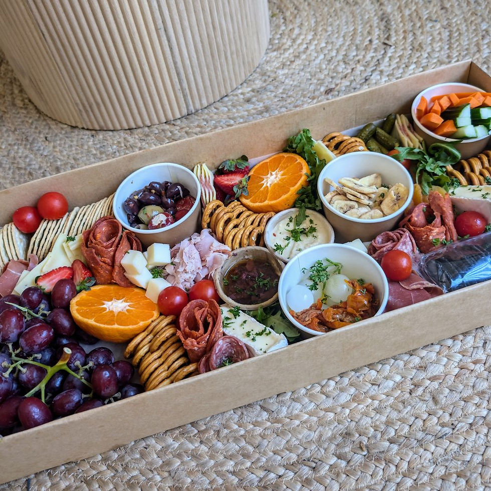 Fresh grazing platter with artisan cheeses, cured meats, fresh fruit, crackers and dips for wedding and event catering.