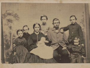 Civil War veteran George W. Warner of Co. B, 20th Connecticut Infantry Regiment with his wife, Katherine, and six children, Alice, Charles, George, Ettie, William, and Ruby.
