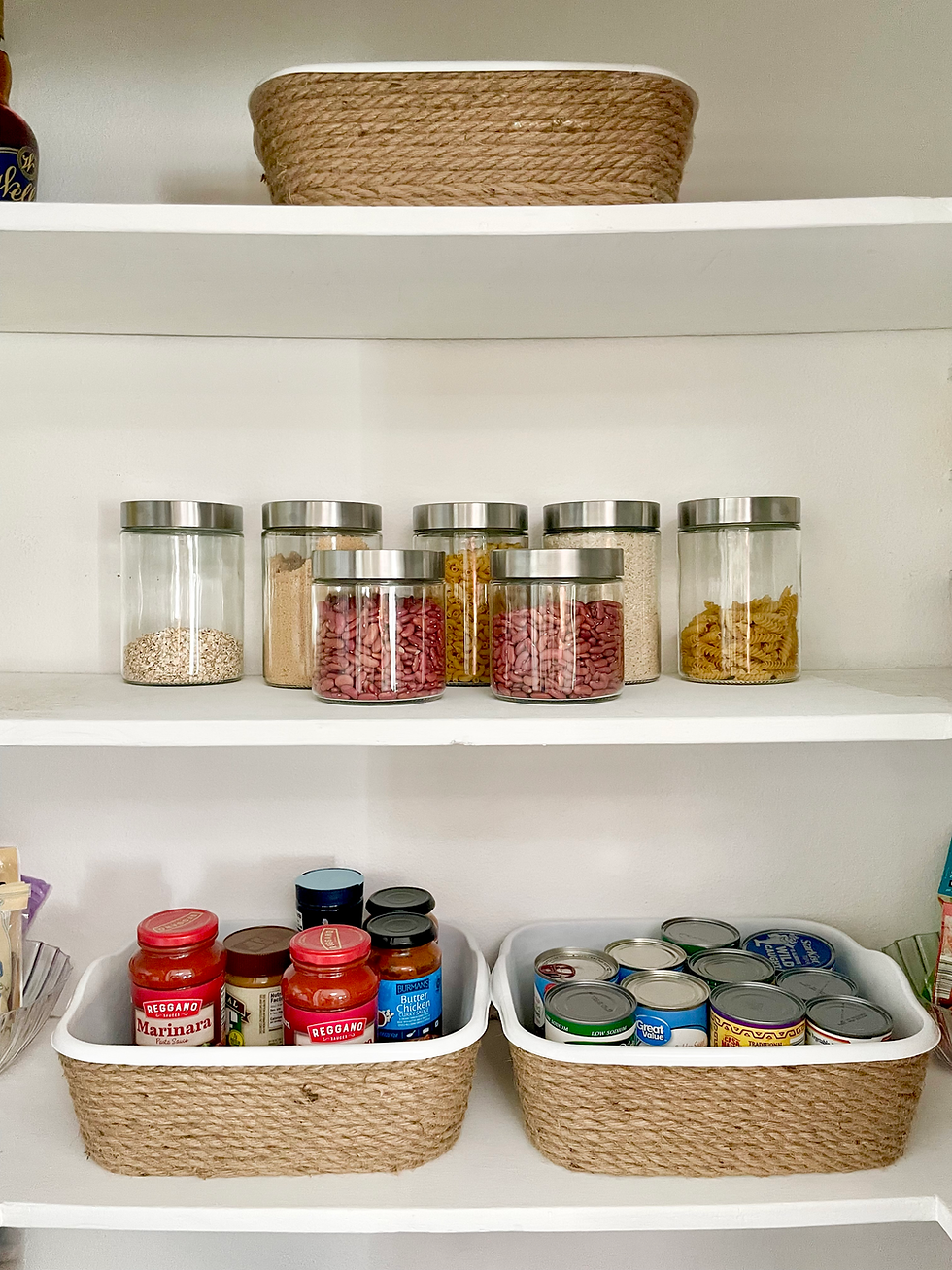 Inexpensive glass containers and woven baskets arranged into an attractive display