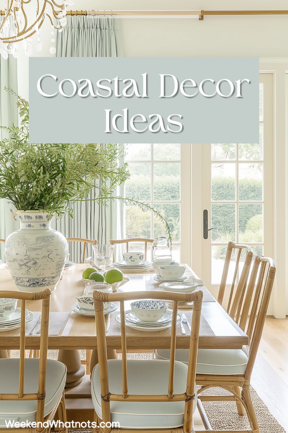 A bright dining room space with natural wood furniture, curtains and upholstery in pale blue colors, and a large green floral arrangement on dining table