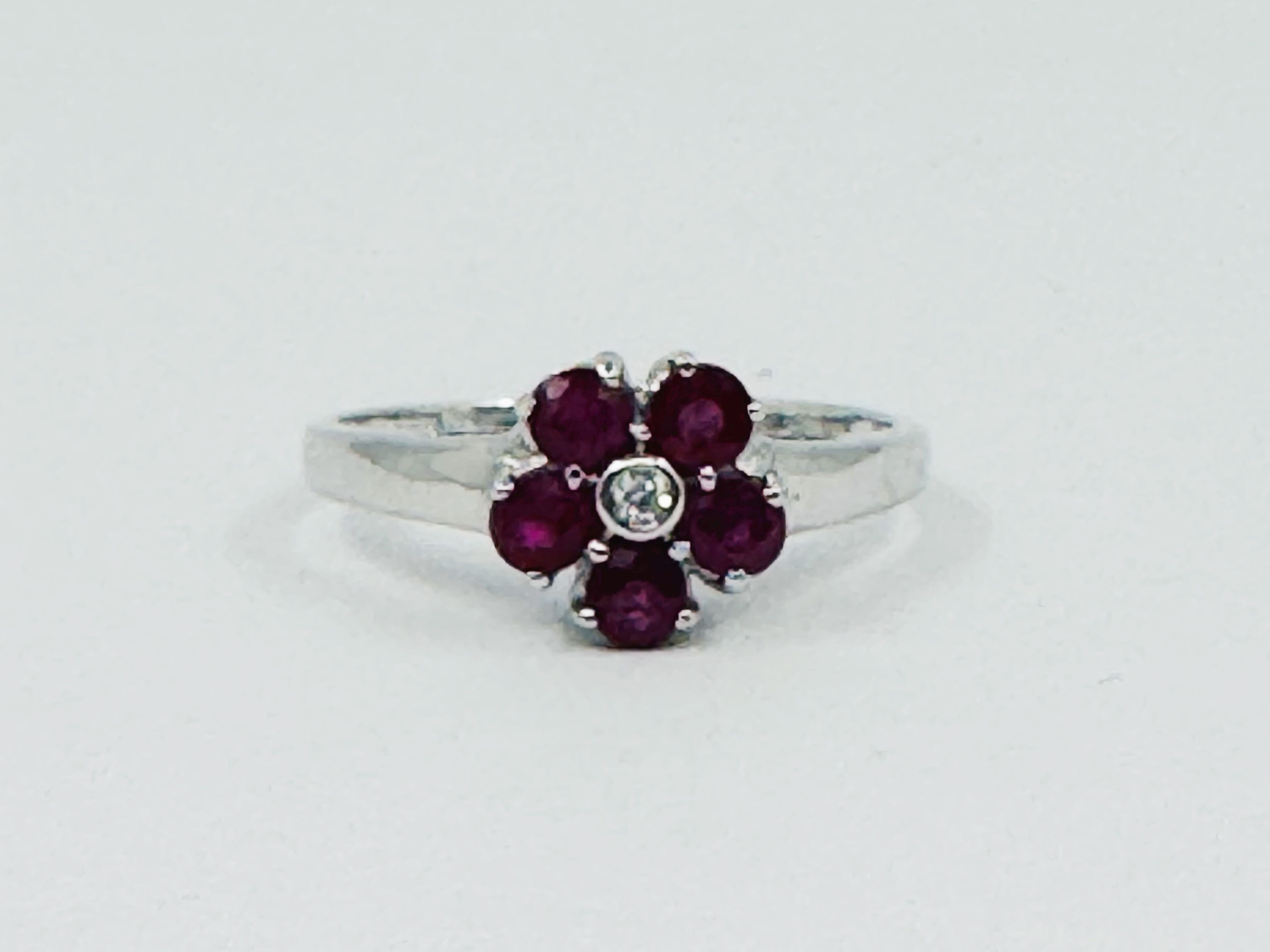 9ct white gold, ruby and diamond ring - size N