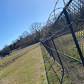 Commercial chain link with barbed wire