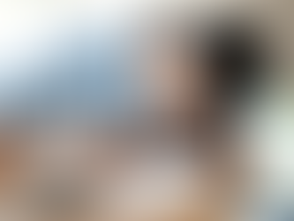 Student solving SAT math problems using a calculator while studying at a desk preparing for the SAT exam.