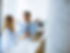 young-business-couple-working-and-discussing-by-laptop-in-the-office-in-front-of-their-tea
