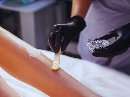 woman getting her legs waxed