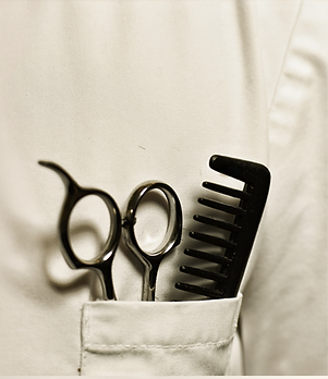 a pair of hairdressing scissors and a comb in a pocket