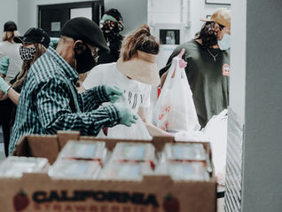 people volunteering at a food bank - volunteer retention