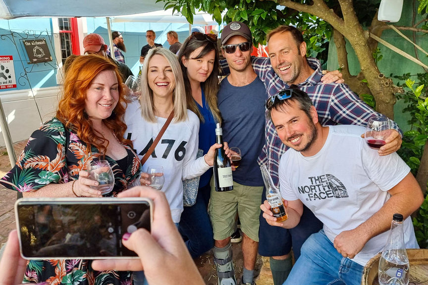 Renowned South African winemaker Eben Sadie (top right) poses with visitors to the Swartland Street Party regional wine festival in Riebeek-Kasteel in South Africa's Western Cape.
