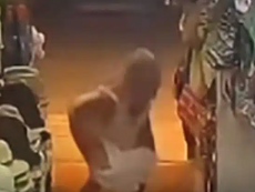 CCTV Captures Foreign Woman Urinating at Entrance of Phuket Beachwear Shop